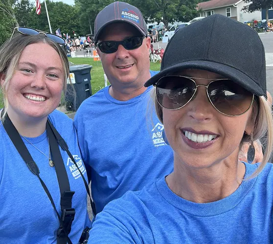 Ascend Exteriors team smiling at a community event