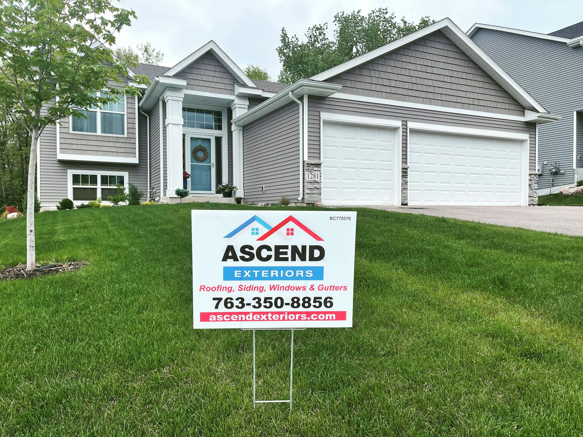 Ascend Exteriors yard sign in front of finished home